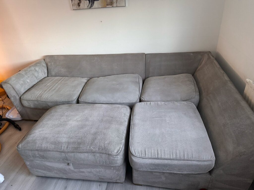 Professional carpet cleaning by Carpet Care Pros in Leigh, showcasing a clean carpet and upholstery restoration service.